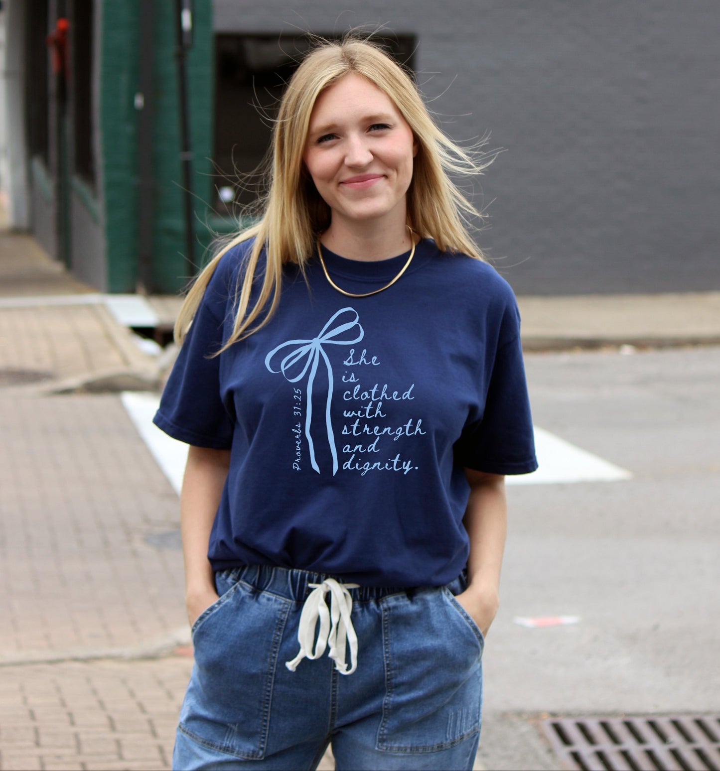 SHE IS CLOTHED WITH STRENGTH AND DIGNITY UNISEX TEE