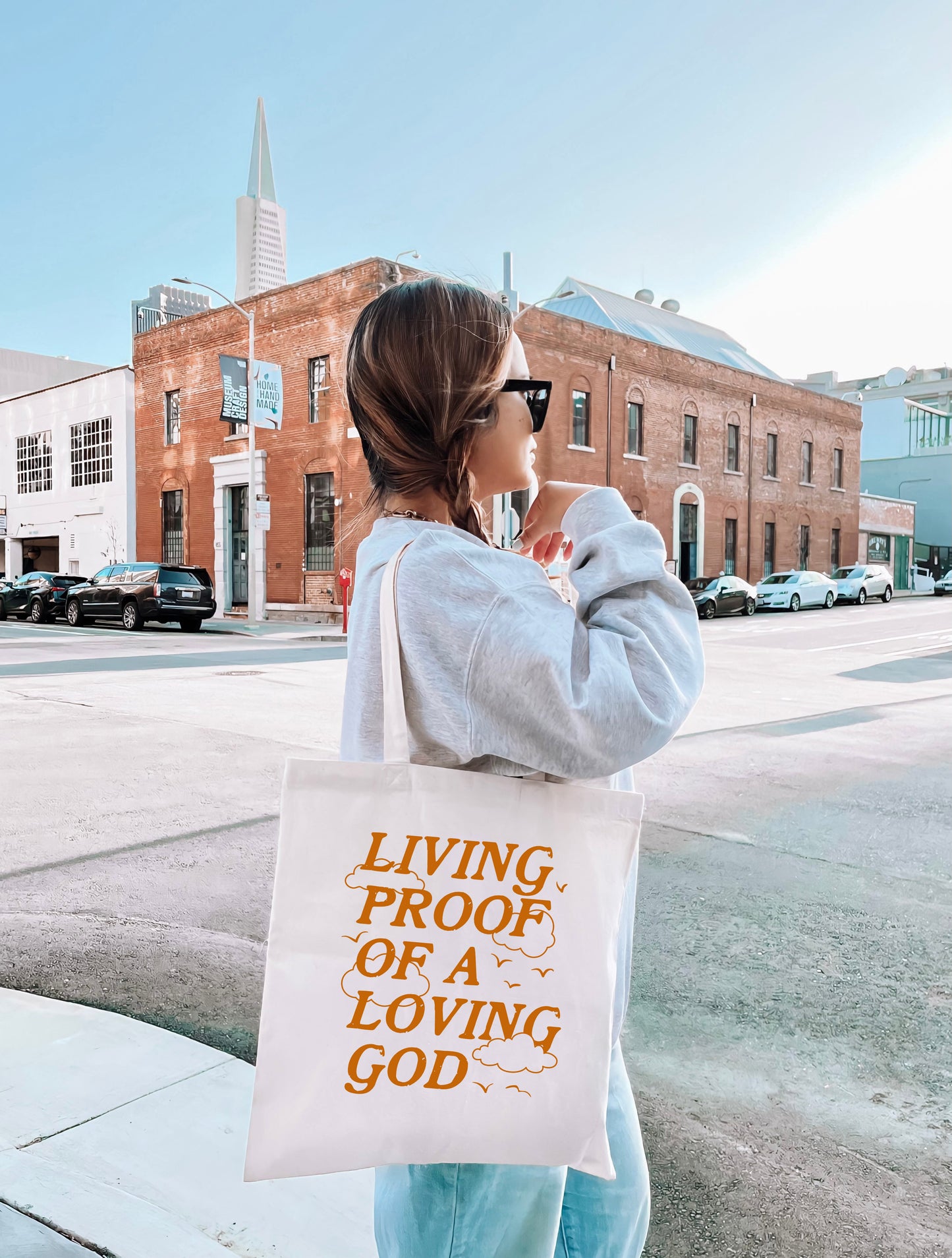 LIVING PROOF OF A LOVING GOD TOTE BAG