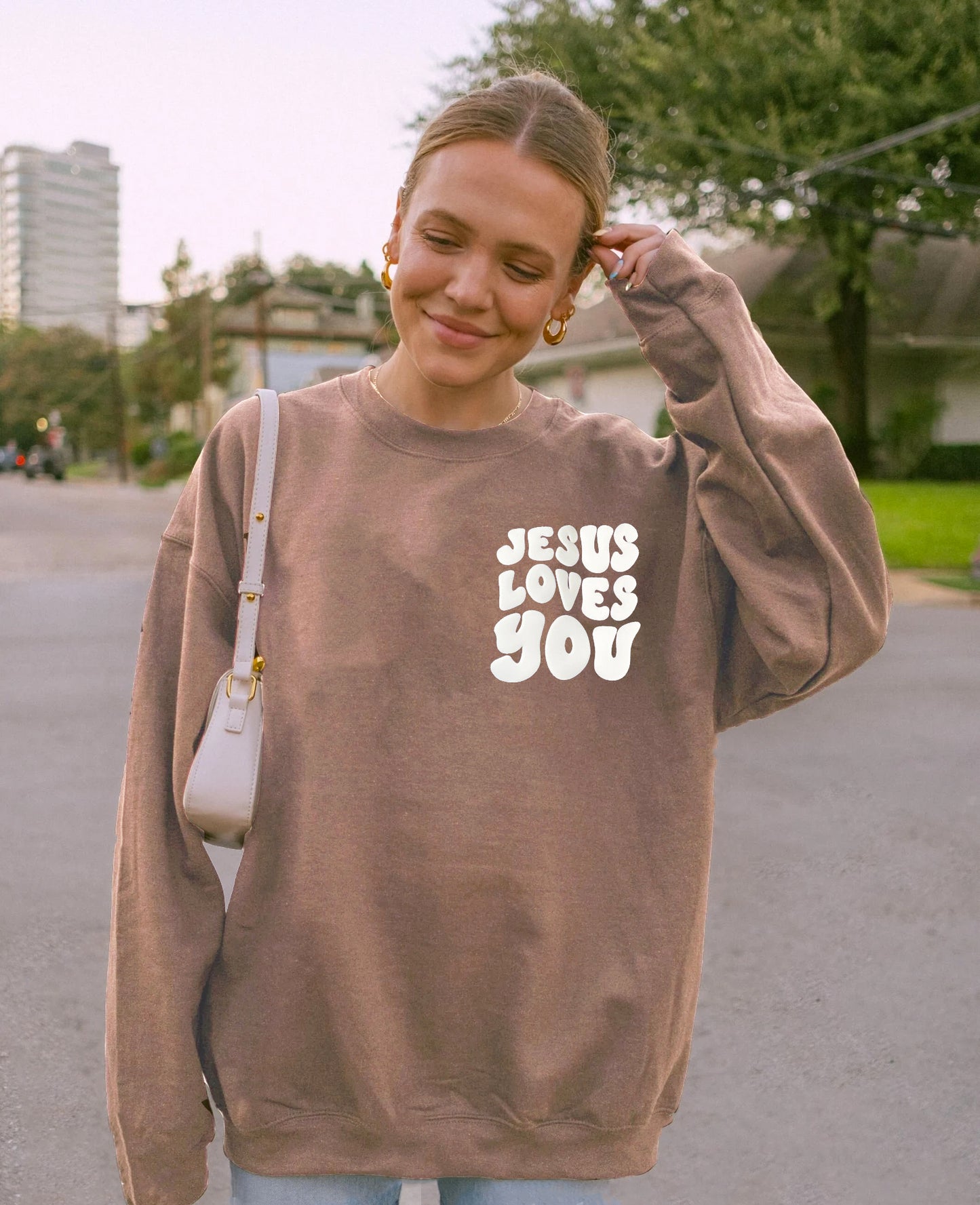 PUFFY JESUS LOVES YOU UNISEX SWEATSHIRT