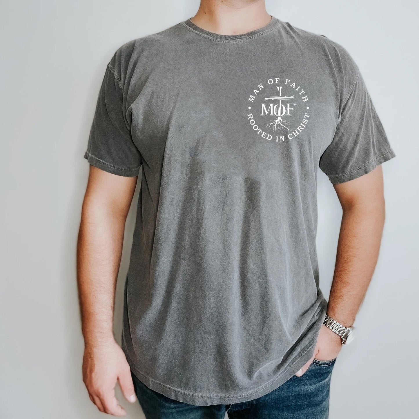 MAN OF FAITH ROOTED IN CHRIST UNISEX PEPPER TEE