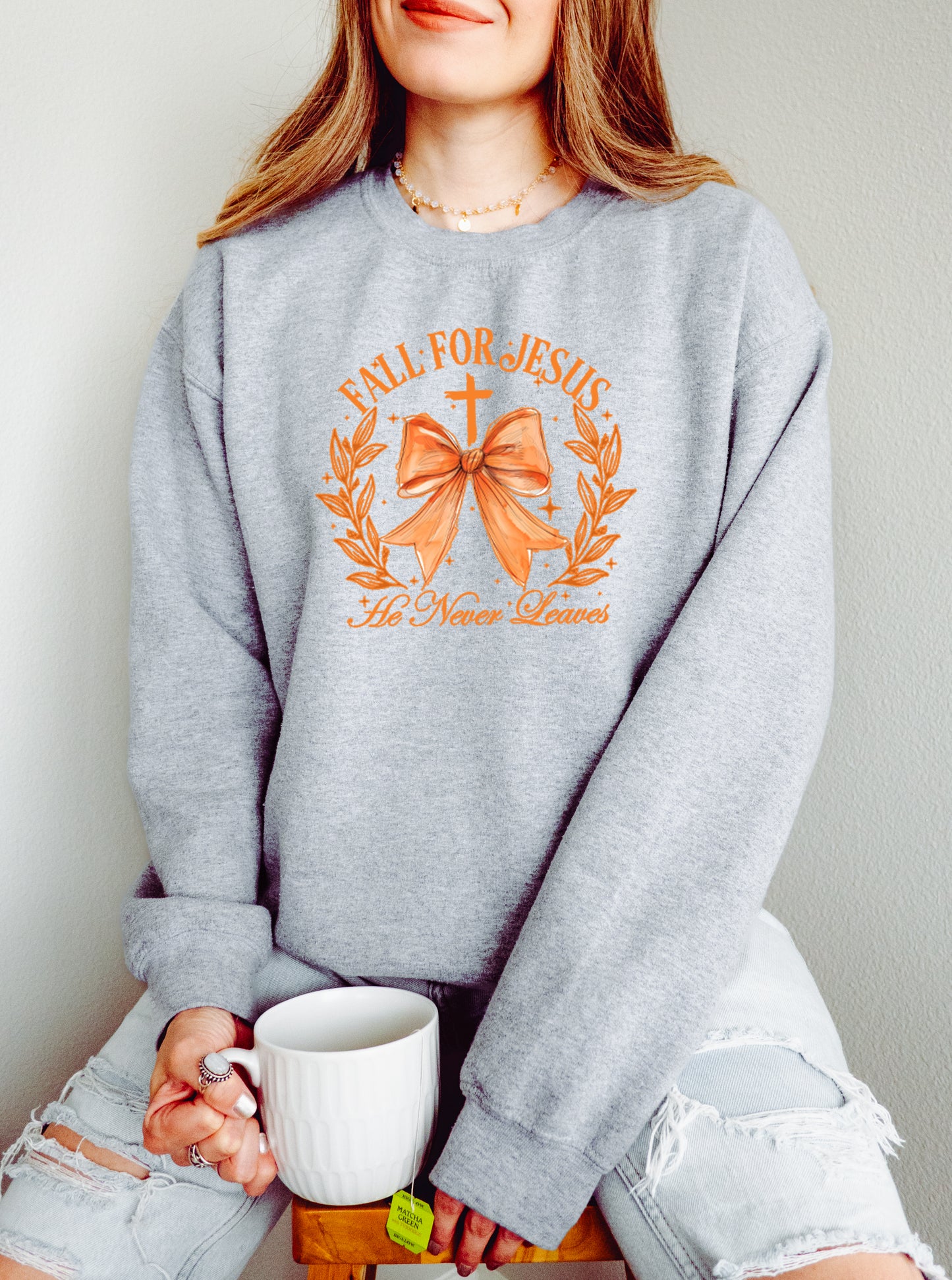 FALL FOR JESUS, HE NEVER LEAVES UNISEX SWEATSHIRT