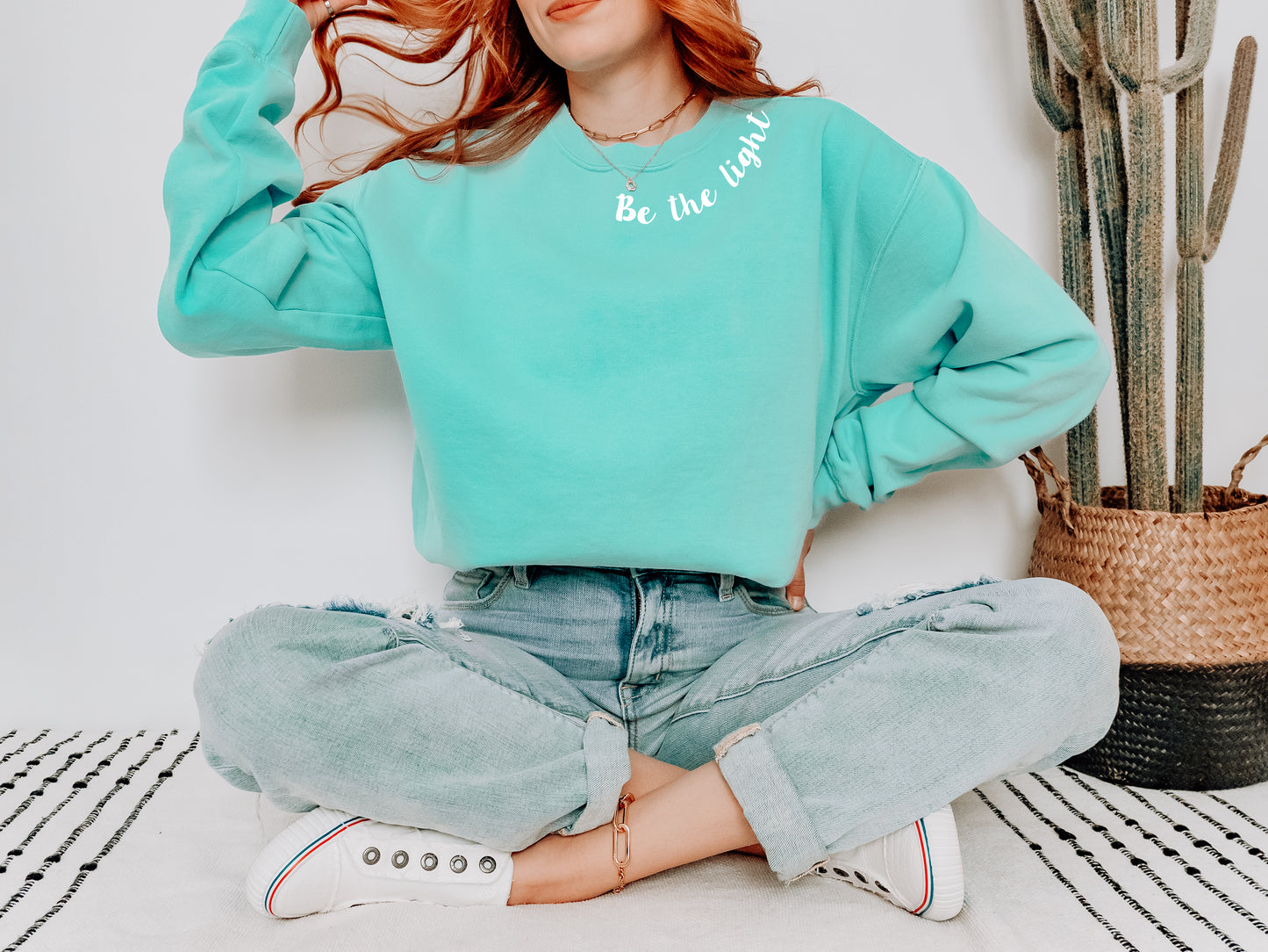 BE THE LIGHT AROUND THE NECK UNISEX SWEATSHIRT