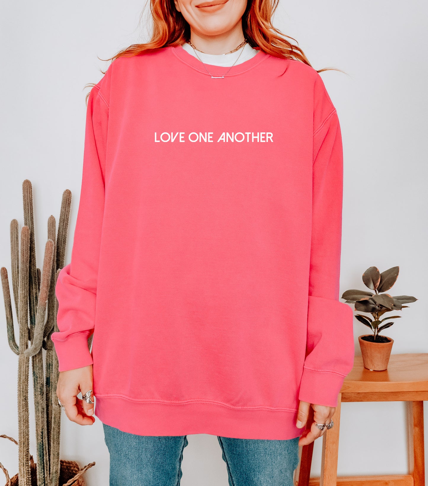 LOVE ONE ANOTHER UNISEX SWEATSHIRT