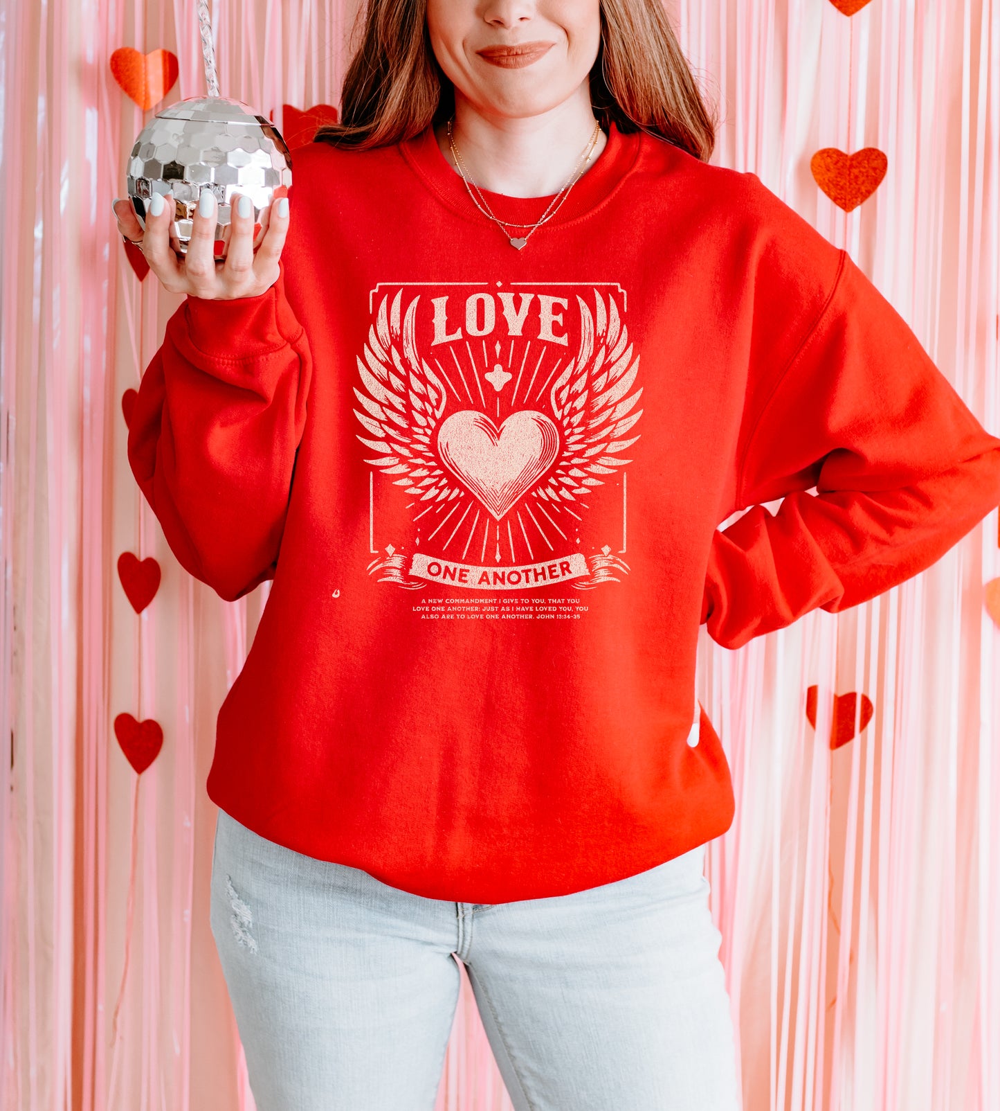 LOVE ONE ANOTHER UNISEX SWEATSHIRT