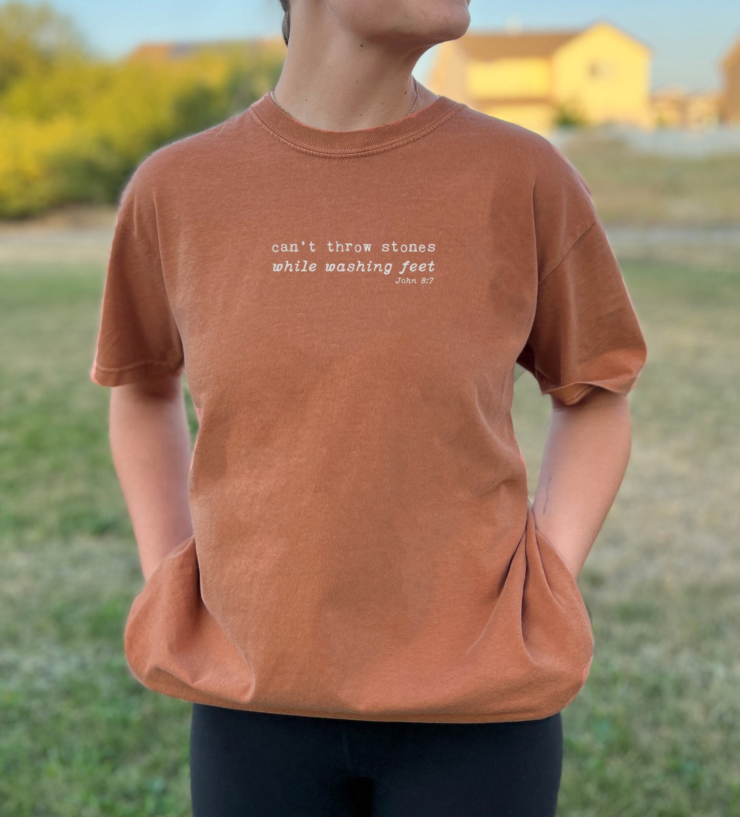 CAN'T THROW STONES WHILE WASHING FEET UNISEX TEE