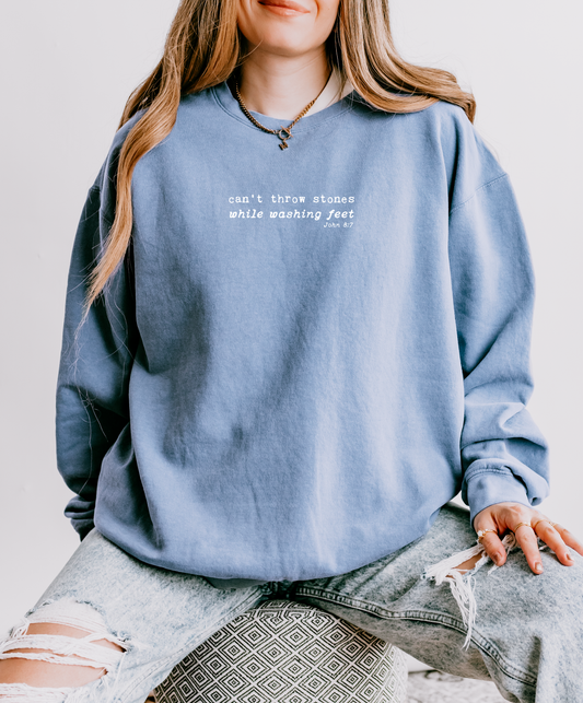 CAN'T THROW STONES WHILE WASHING FEET UNISEX SWEATSHIRT