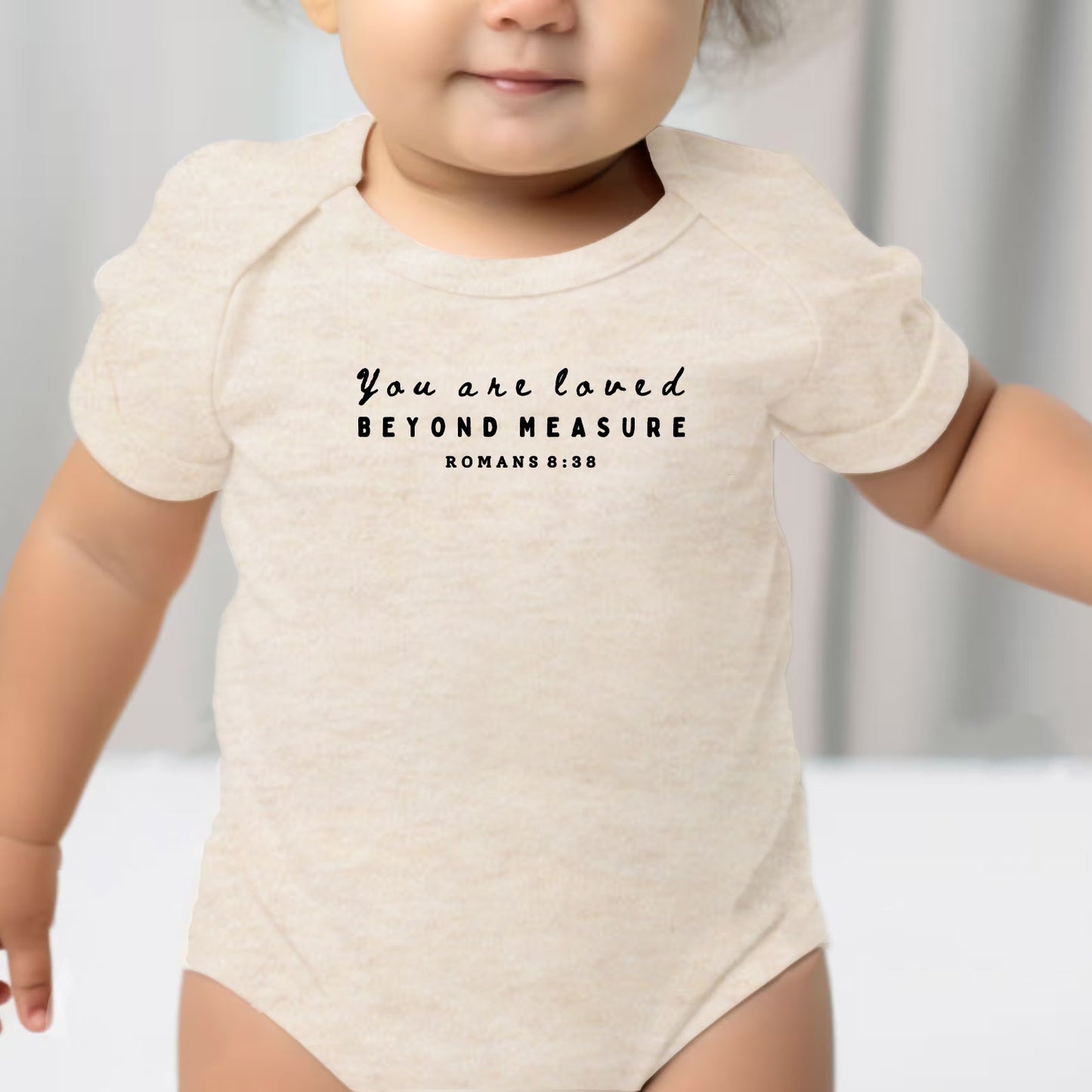 "YOU ARE LOVED BEYOND MEASURE" BODYSUIT IN OATMEAL
