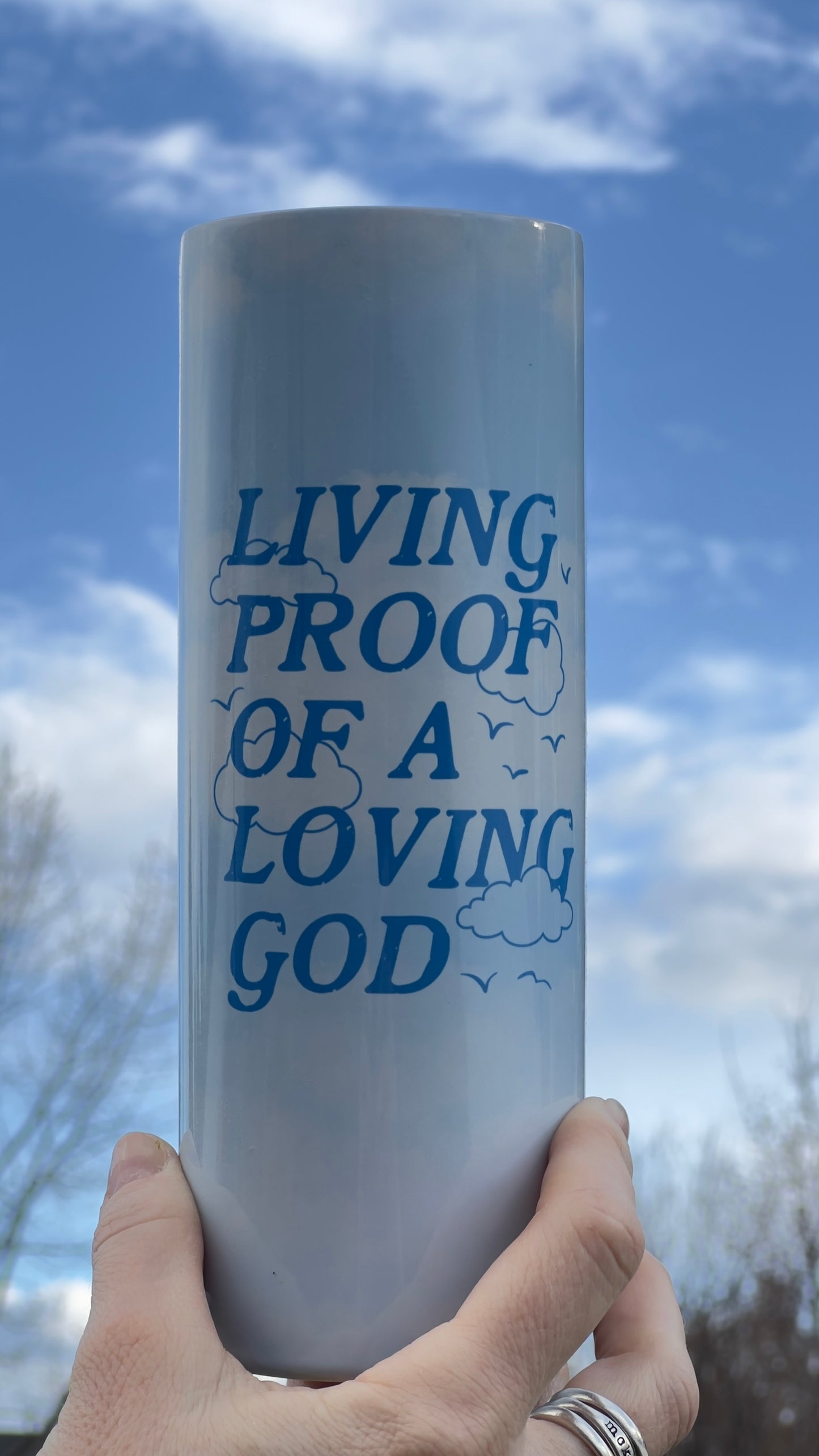 LIVING PROOF OF A LOVING GOD 20 OZ. SKINNY STAINLESS STEEL TUMBLER