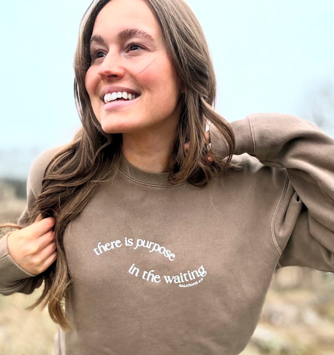 THERE IS PURPOSE IN THE WAITING UNISEX SWEATSHIRT