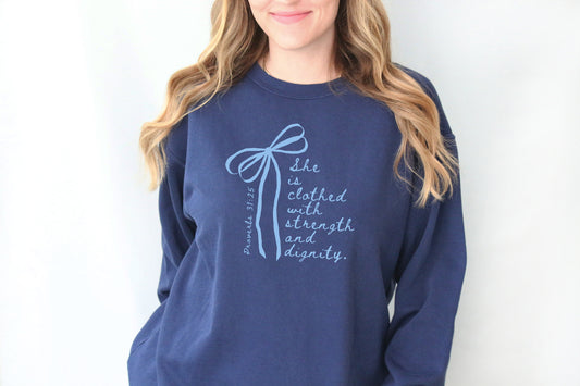 SHE IS CLOTHED WITH STRENGTH AND DIGNITY UNISEX SWEATSHIRT