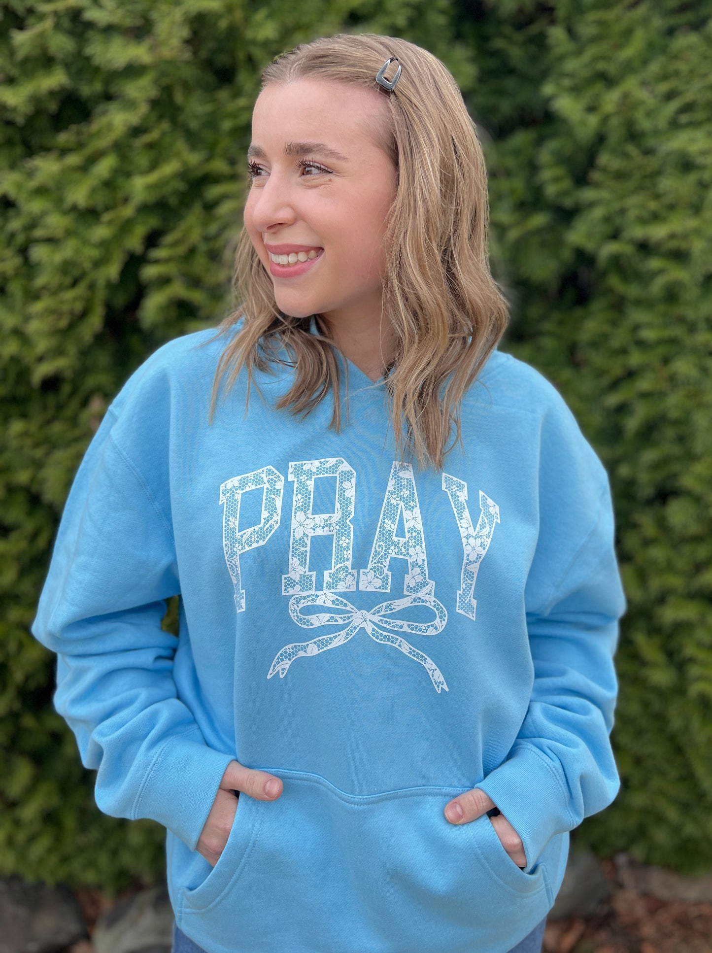 PRAY WITH BOW UNISEX HOODED SWEATSHIRT