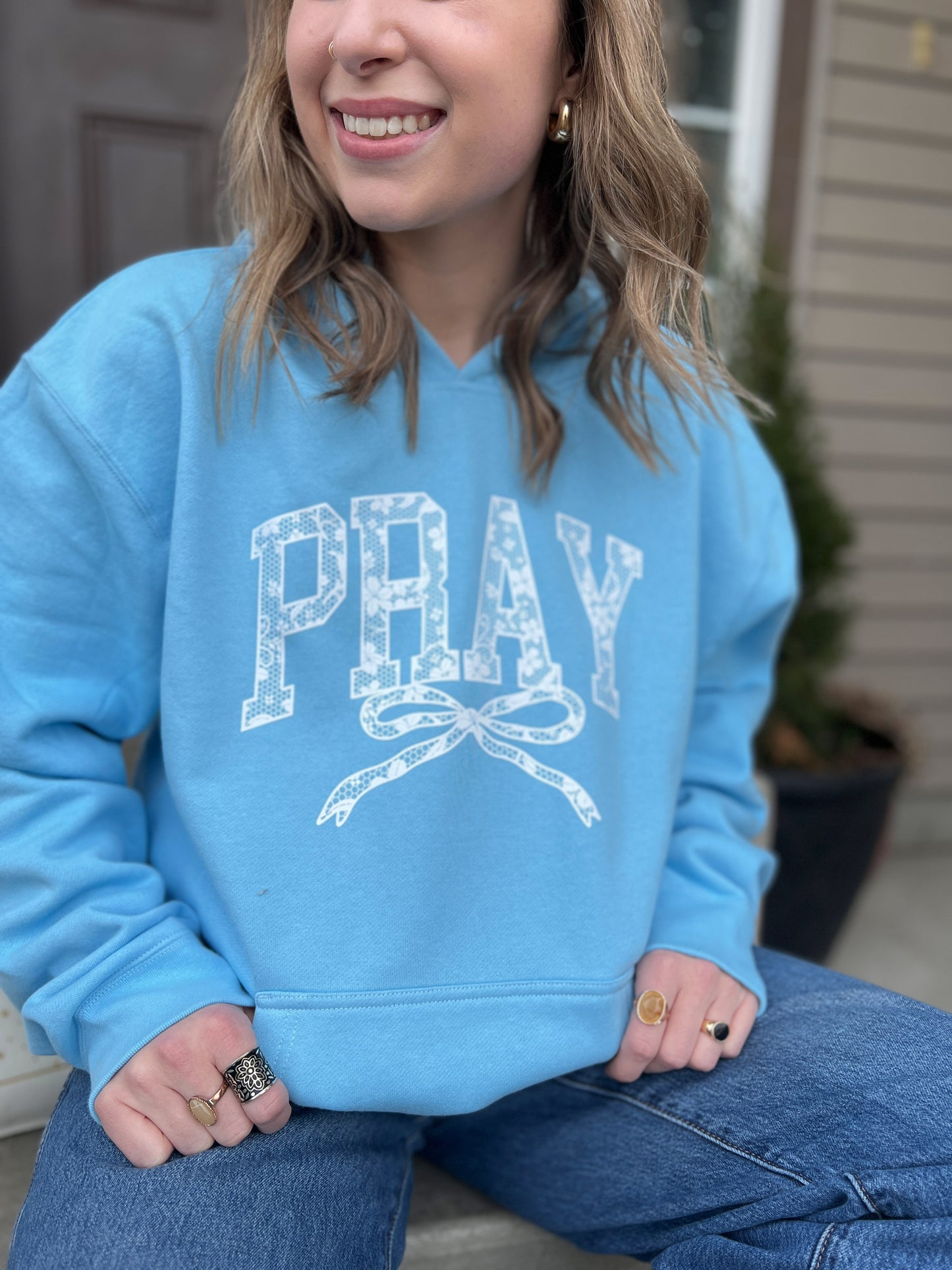 PRAY WITH BOW UNISEX HOODED SWEATSHIRT