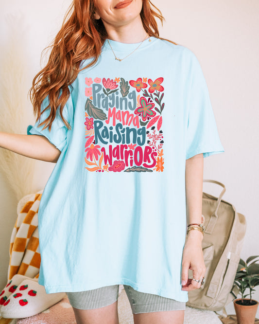 PRAYING MAMA RAISING WARRIORS UNISEX TEE