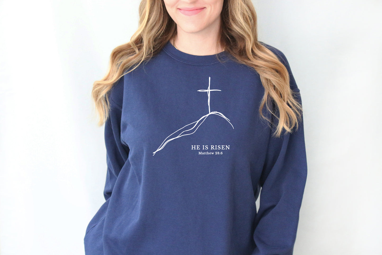 EASTER MINIMALIST CROSS ON A HILL UNISEX SWEATSHIRT