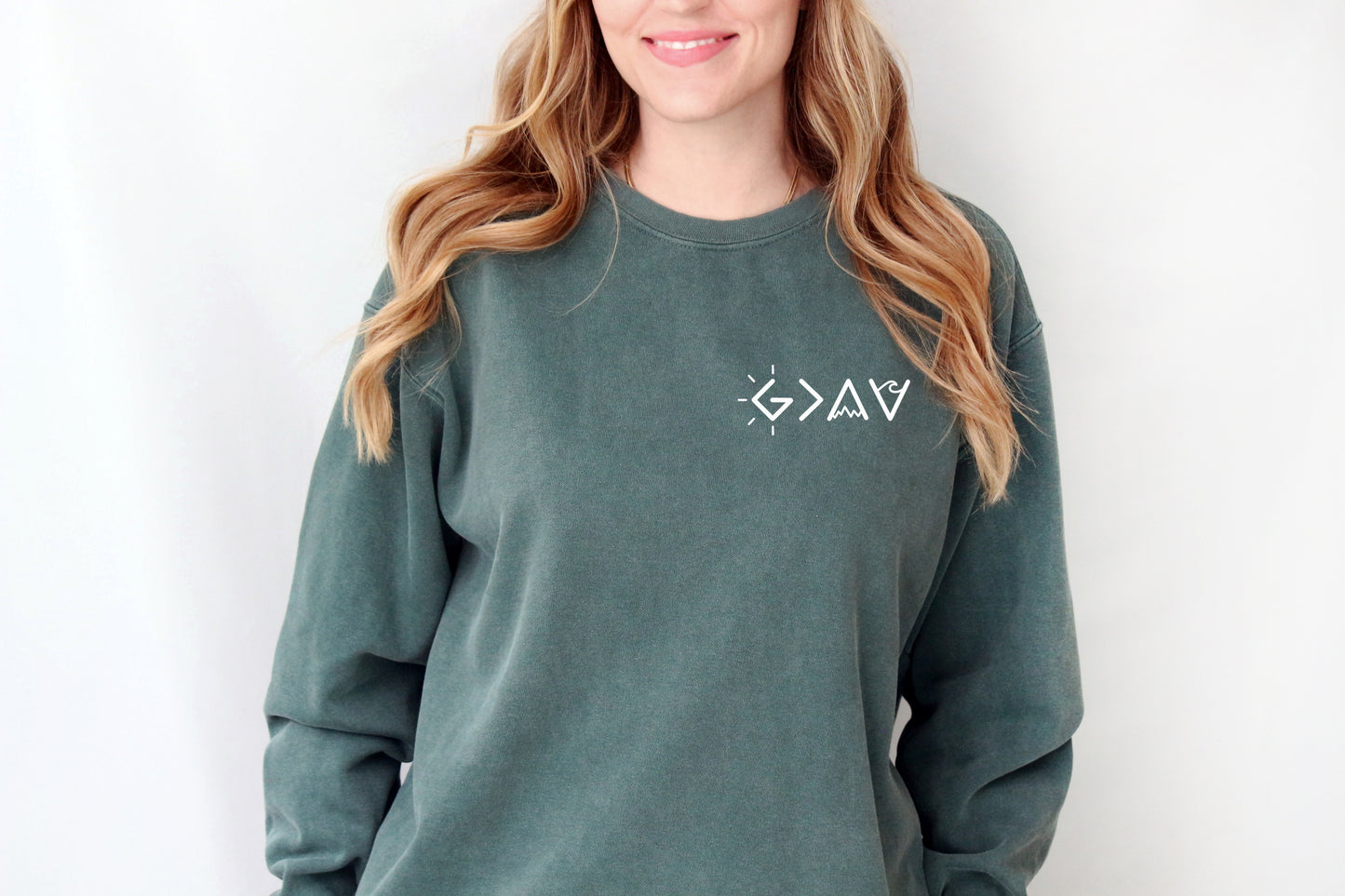 GOD IS GREATER THAN OUR HIGHS AND LOWS SWEATSHIRT