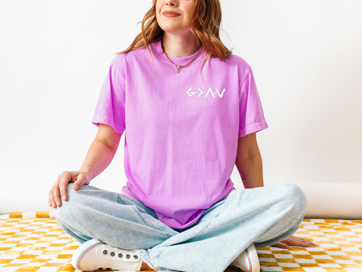 GOD IS GREATER THAN OUR HIGHS AND LOWS UNISEX TEE  - SIZE SMALL IN NEON VIOLET