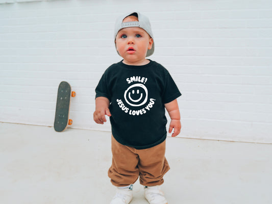 SMILE! JESUS LOVES YOU TODDLER BLACK TEE