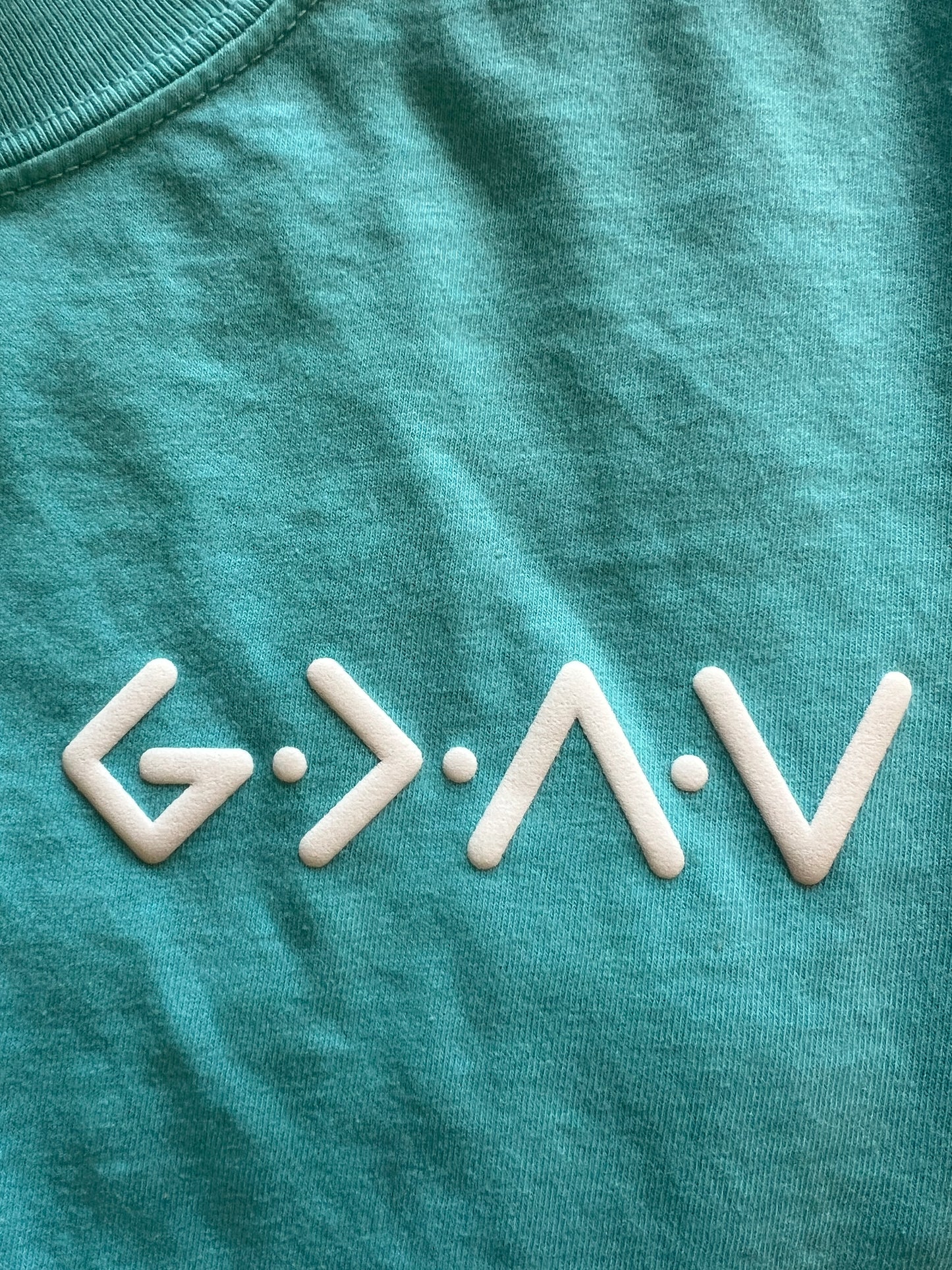 PUFFY GOD IS GREATER THAN OUR HIGHS AND LOWS NEON COLORS UNISEX TEE