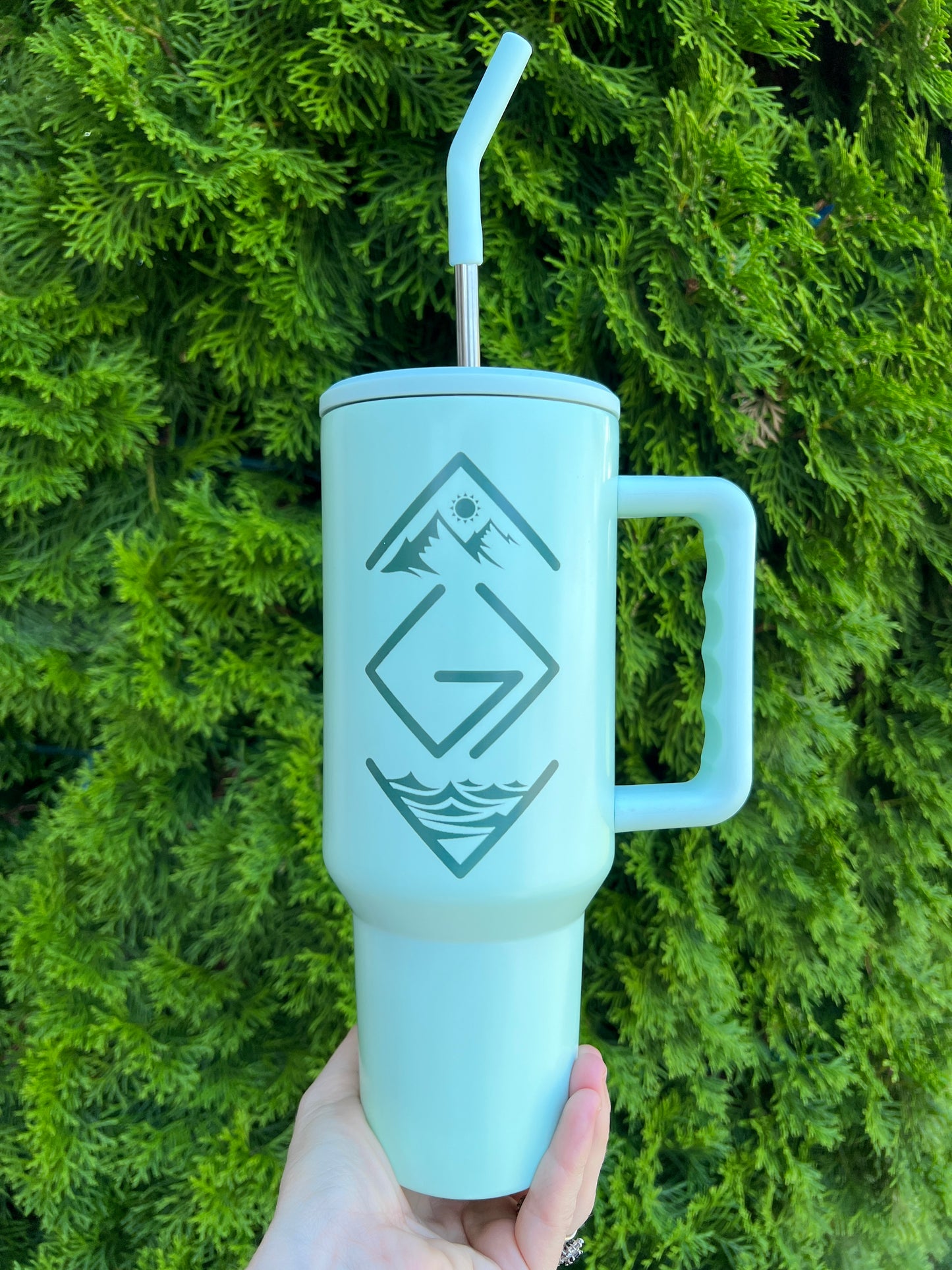 GOD IS GREATER THAN OUR HIGHS AND LOWS 40 OZ. STAINLESS STEEL TUMBLER IN MINT GREEN